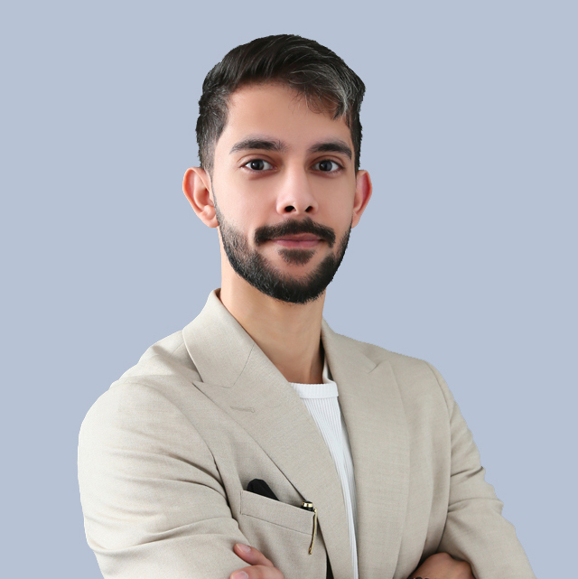 Pin Homes Real Estate LLC Team Member wearing Skin color shirt and smiling